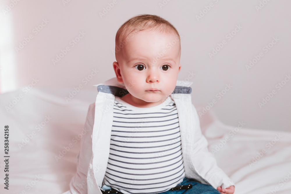 close up portrait of baby boy on bed. Family concept close up portrait of baby boy on bed. Family concept