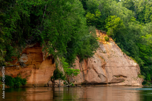 Red sandstone cliff on coast of the river