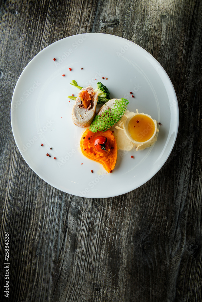 delicious dissected stuffed chicken with pumpkin puree and yellow sauce delicious dissected stuffed chicken with pumpkin puree and yellow sauce