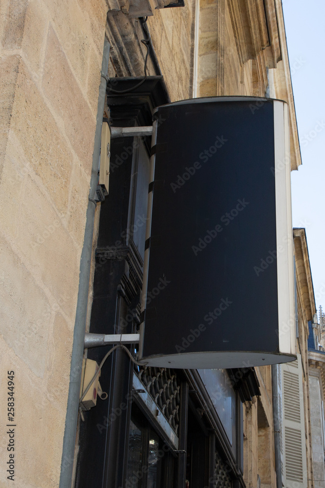 blank empty signboard shop on the street Black square sign on the store wall in Mock up