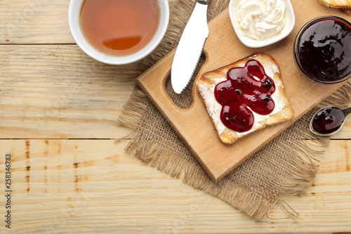 Wallpaper Mural toasts with jam. fried crispy toast with red jam on a natural wooden table. breakfast. top view Torontodigital.ca