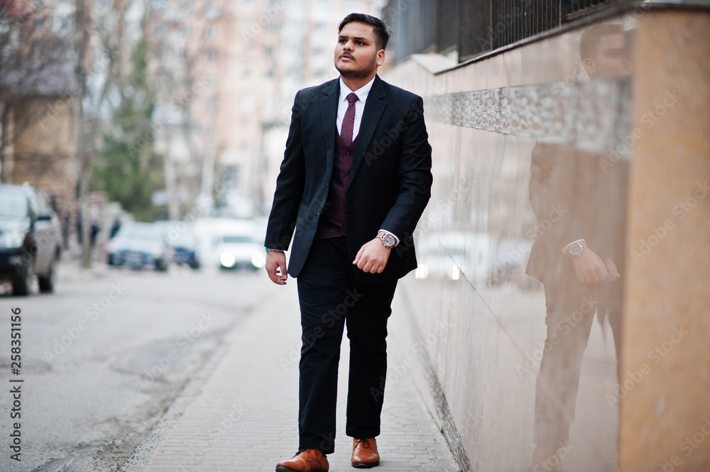 Stylish indian businessman in formal wear posed at street.