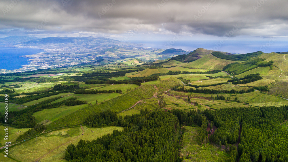 Drone view of amazing Azores landscape. Green fields on the north coast of San Miguel island, Azores, Portugal. Bird eye view, aerial panoramic view.