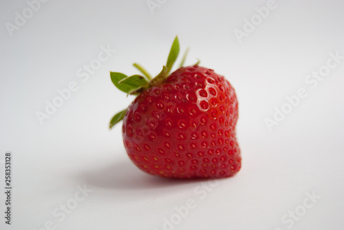 Single fresh and ripe strawberry