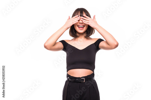 Beautiful young woman covers face with hands, isolated on a white background © F8  \ Suport Ukraine