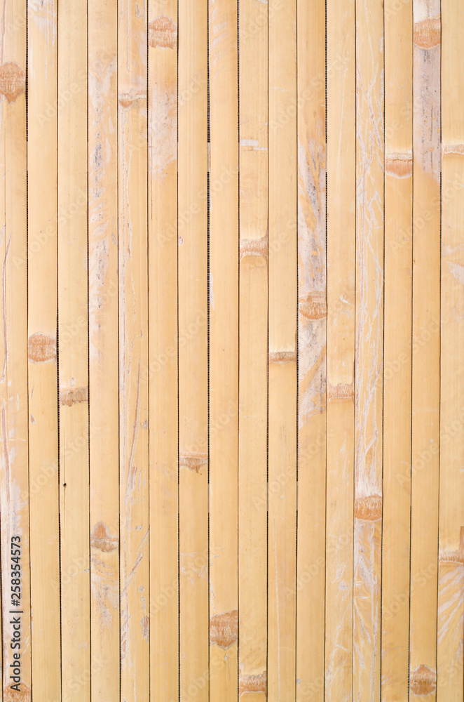 Fototapeta premium Old bamboo of strips on wall close up