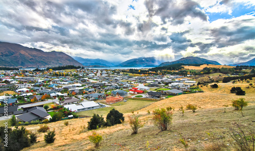 The town of Wanaka on New Zealand's south island, next to Lake Wanaka, with the Matukituki Valley in the distance. Photographed from Iron Mountain. photo