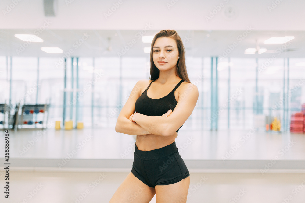 Beautiful girl in the gym. Sports and fitness, healthy lifestyle.
