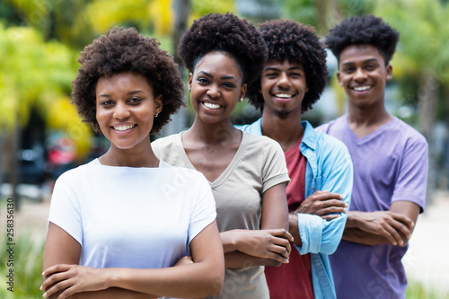 Group of african american young women and men in line