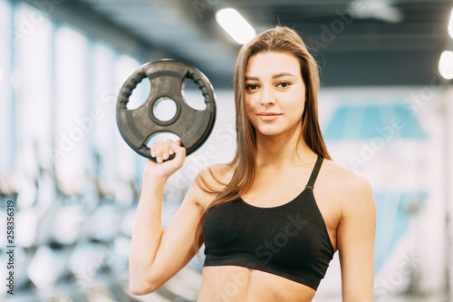 Beautiful girl in the gym. Sports and fitness, healthy lifestyle.