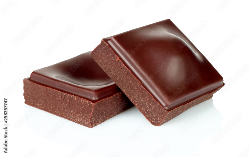 Dark chocolate pieces isolated on white background Dark chocolate pieces isolated on white background