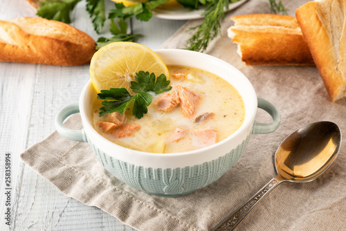 Finnish creamy soup with salmon, potatoes, onions, and carrots