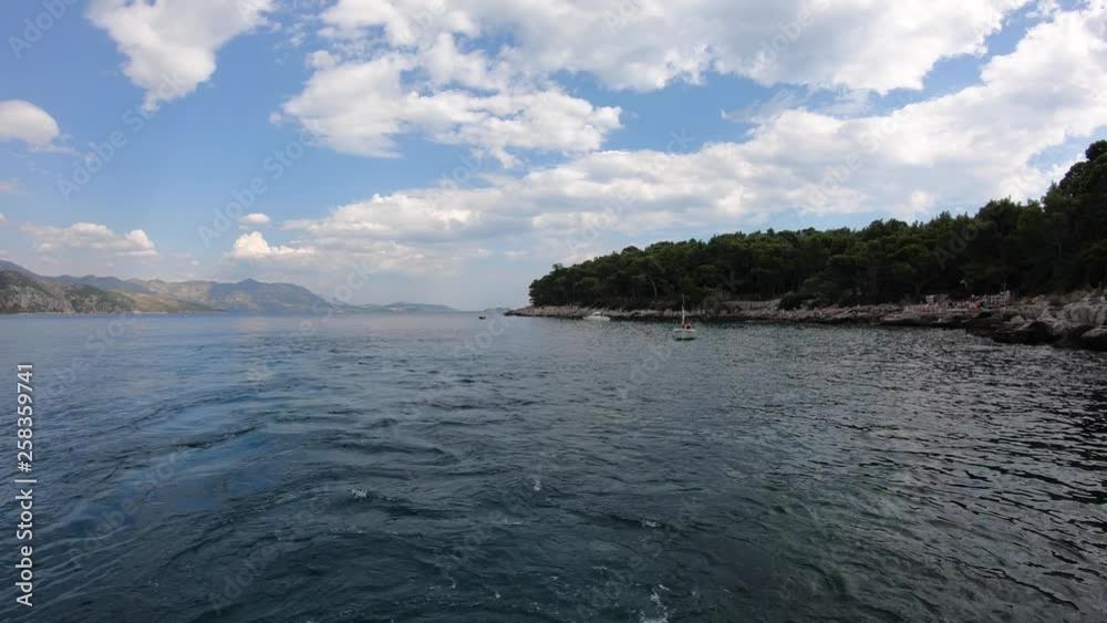 4K. Lokrum Island in the Adriatic Sea, Dubrovnik, Croatia. View from the tourist ferry. Beautiful clouds. 4K. Lokrum Island in the Adriatic Sea, Dubrovnik, Croatia. View from the tourist ferry. Beautiful clouds.
