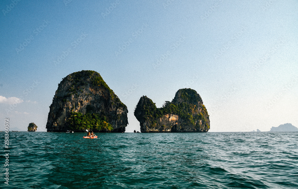 Kayaking along coast near Railay Beach in Thailand Kayaking along coast near Railay Beach in Thailand