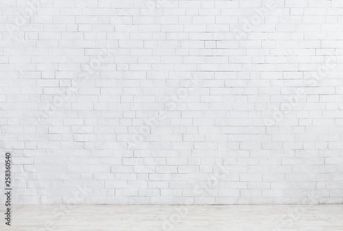 White brick wall and white wooden floor