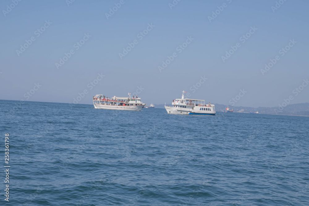 A large private motor yacht under way out at sea A large private motor yacht under way out at sea