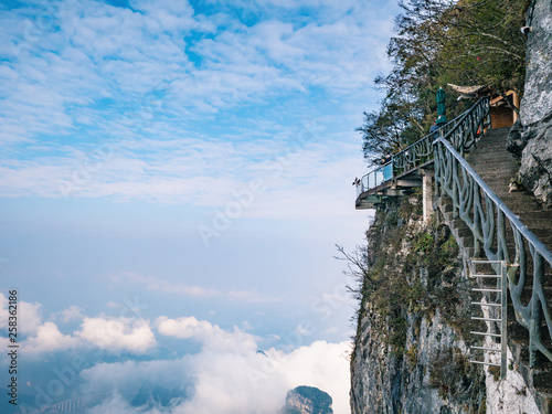 Unacquainted Tourists on Glass Cliff walk in tianmen mountain at Zhangjiajie city china.Tianmen mountain the travel destination of Hunan zhangjiajie city China