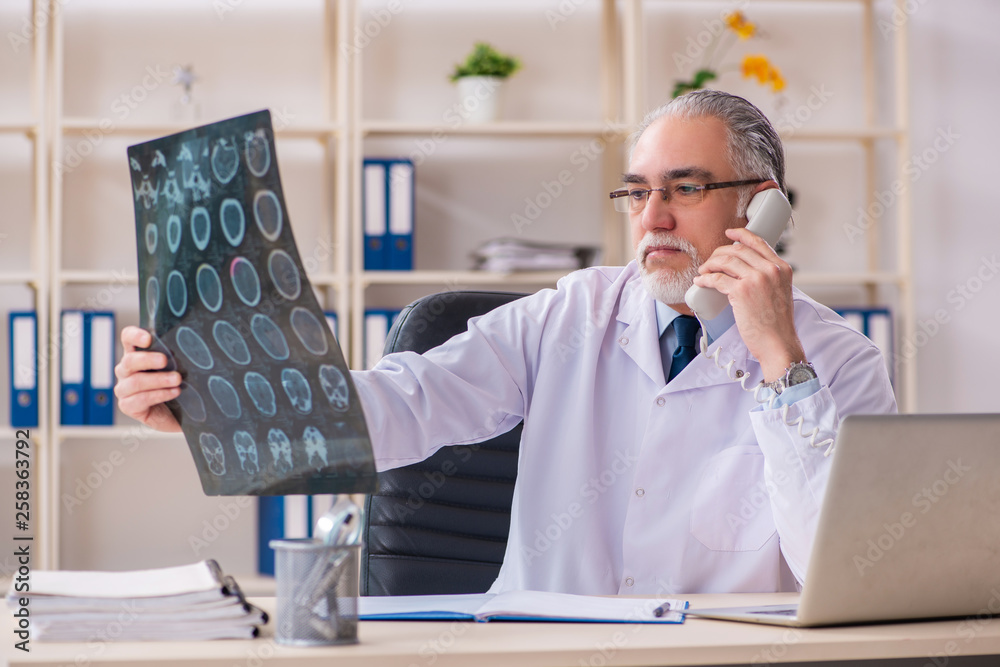 Fototapeta premium Aged male doctor radiologist in the clinic