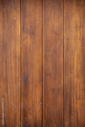 Wood planks or Hardwood panel texture dark background or wallpaper vertical.