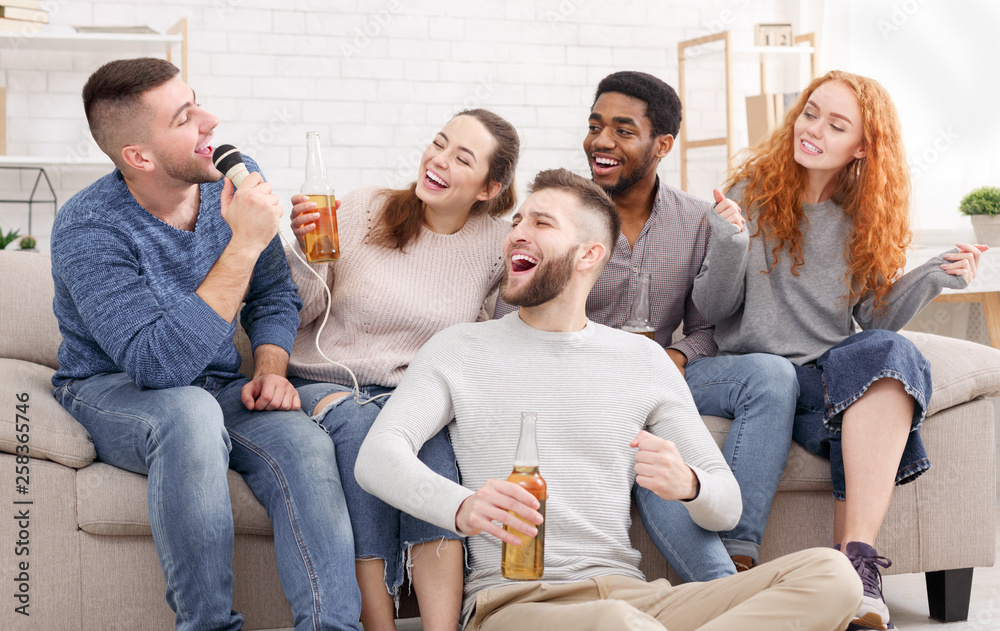 Group of friends having fun, singing songs together