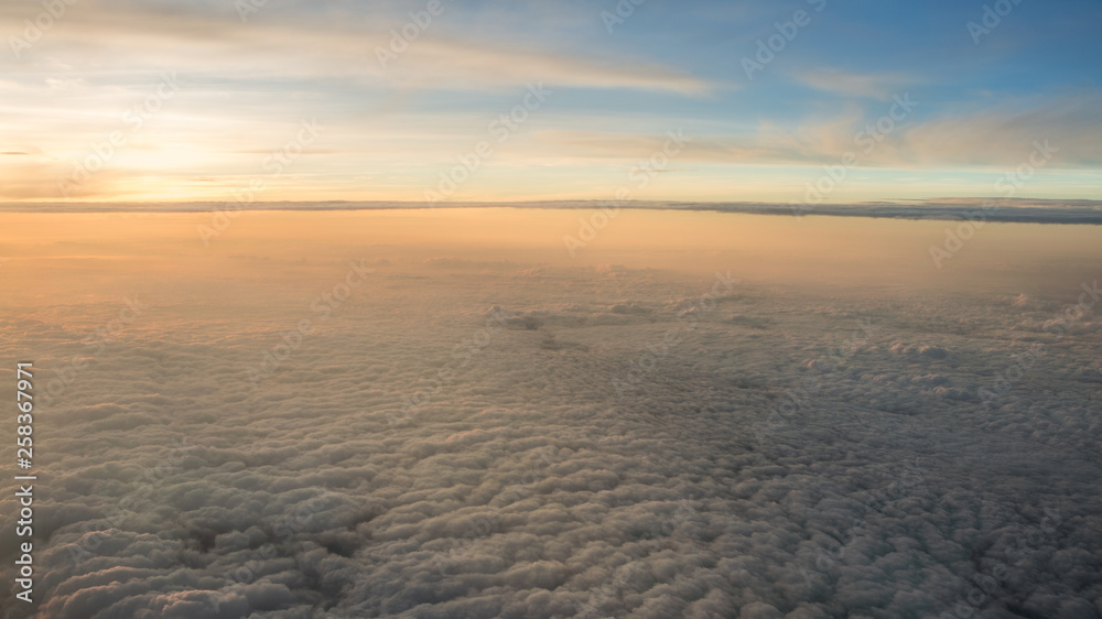 Aerial traveling. Flying at dusk or dawn. Fly through orange cloud and sun. Aerial traveling. Flying at dusk or dawn. Fly through orange cloud and sun.