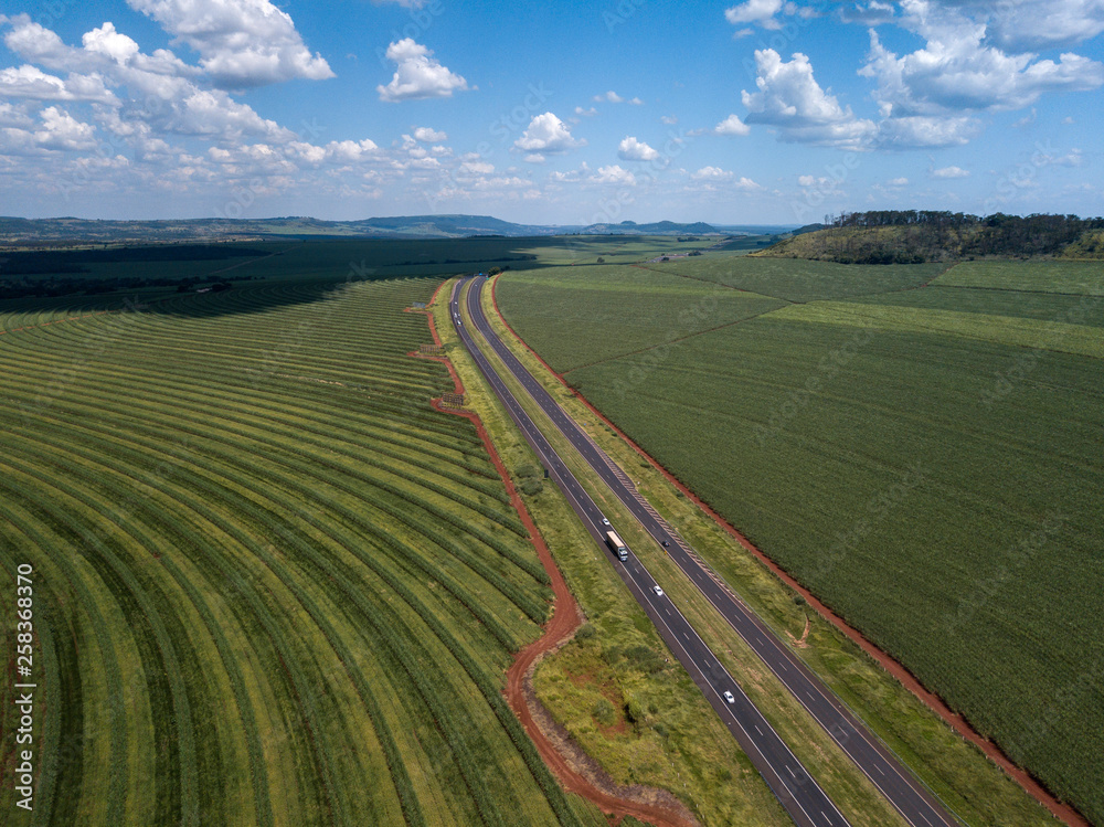 Aerial sugarcane field and highway in Brazil.