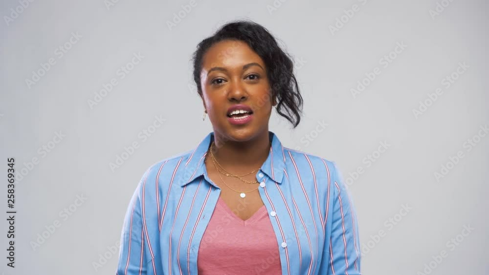 blogging, hiring and employment concept - happy african american woman having video call or interview over grey background