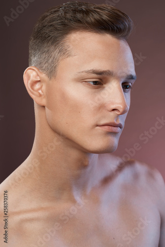 Young handsome man close up portrait