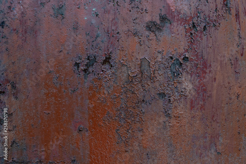 Macro texture of peeled paint on rusty iron closeup.
