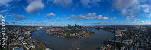 Aerial bird's eye view panoramic drone photo of Greenwich park with views to Canary Wharf and University of Greenwich with beautiful cloudy sky, Isle of Dogs, London, United Kingdom © aerial-drone