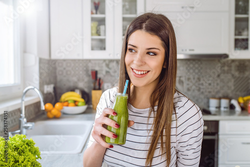 Healthy Eating Woman Drinking Fresh Raw Green Detox Vegetable Juice.