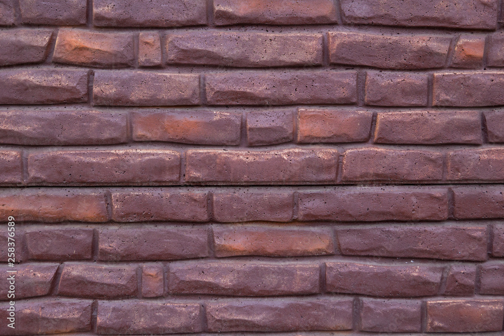 Background of purple bricks. Construction Materials Background of purple bricks. Construction Materials