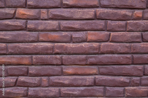 Background of purple bricks. Construction Materials