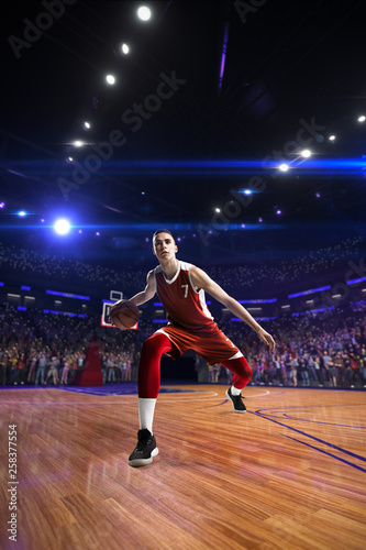 Basketball player in jump. around Arena with blue light spot