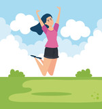 woman jumping in the park with casual clothes