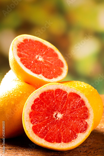 Freshly red grapefruit on wooden background