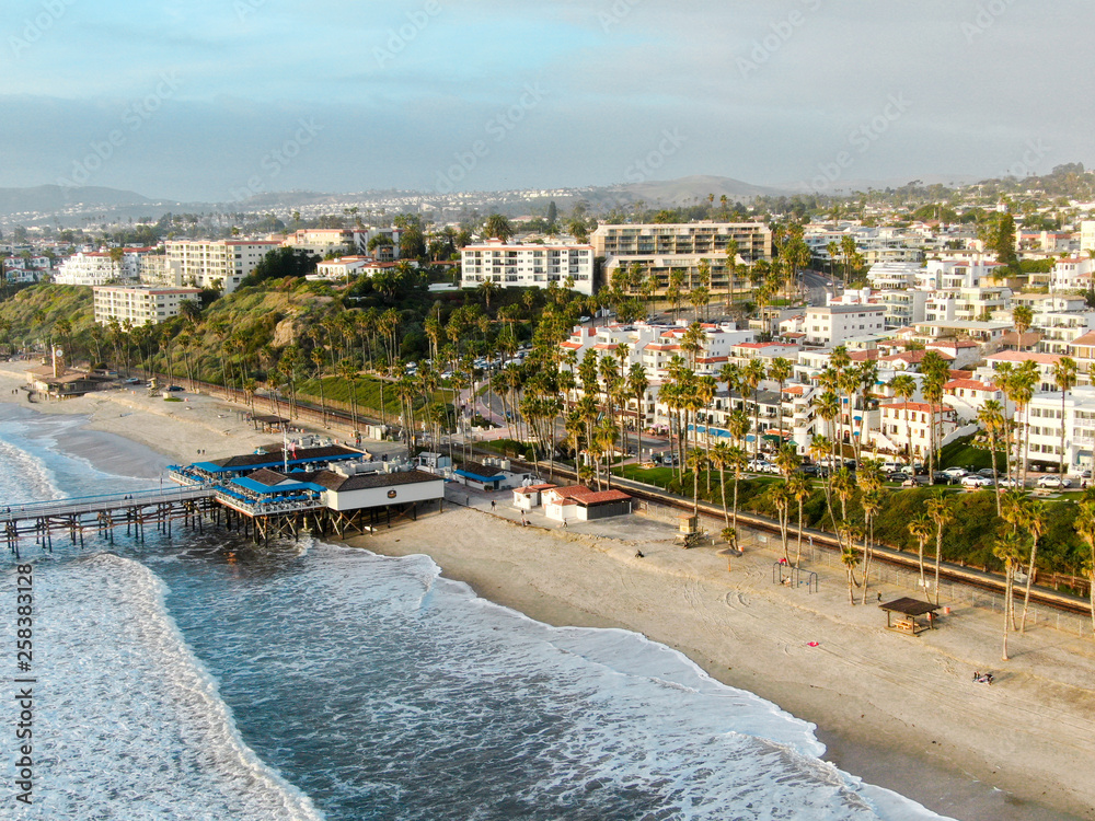 Aerial view of San Clemente Pier with beach and coastline. San Clemente city in Orange County, California, USA. Travel destination in the South West Coast. Famous beach for surfer.