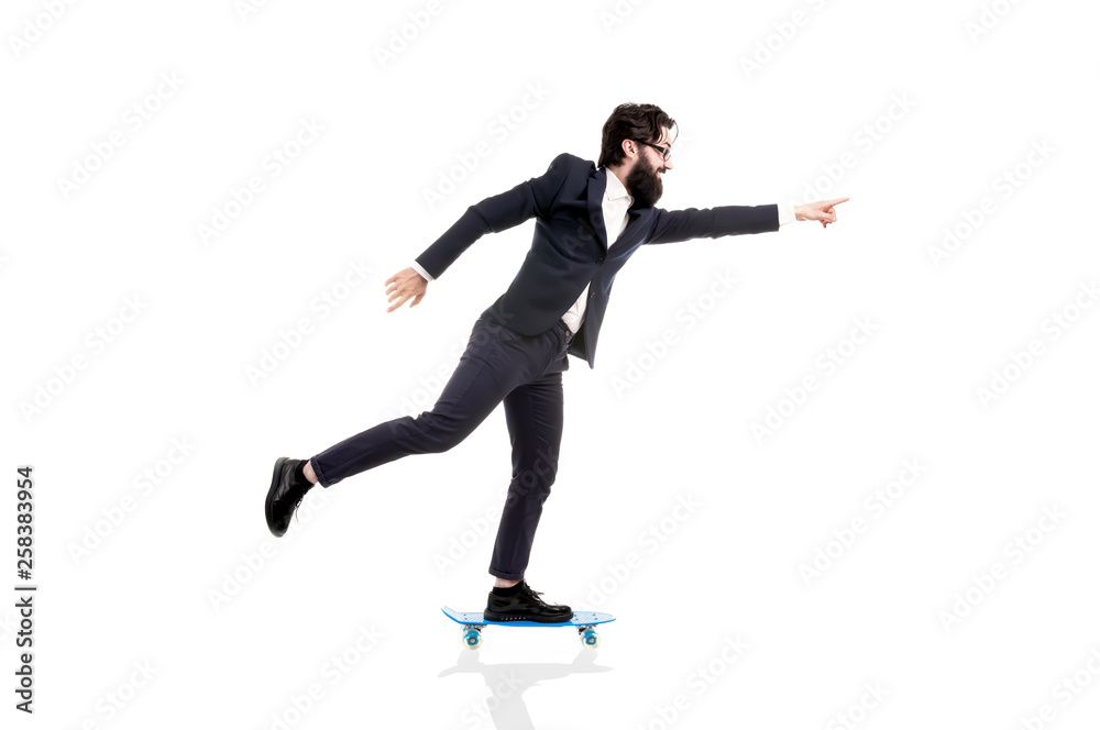 bearded businessman riding a skateboard, man pointing finger on copy space, isolated on white background