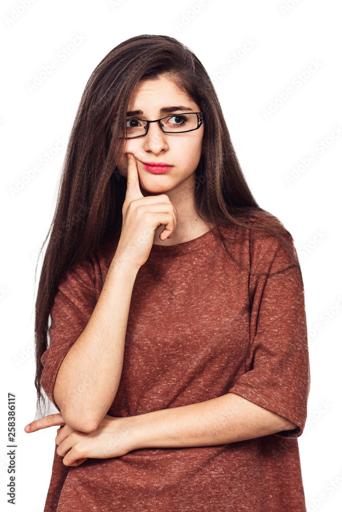A young pretty girl with glasses thought about something. A young pretty girl with glasses thought about something.