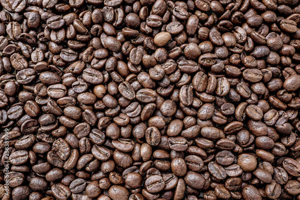 Roasted coffee beans background tinted Roasted coffee beans background tinted