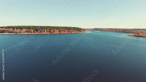 Top view of river with forests along the riverside