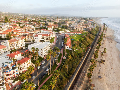Fototapeta Naklejka Na Ścianę i Meble -  Aerial view of San Clemente city and coastline cliff before sunset time. San Clemente city in Orange County, California, USA. Travel destination in the South West coast. Wealthy villas area.