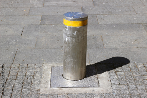 Retractable bollard street pavement sidewalk cobblestone