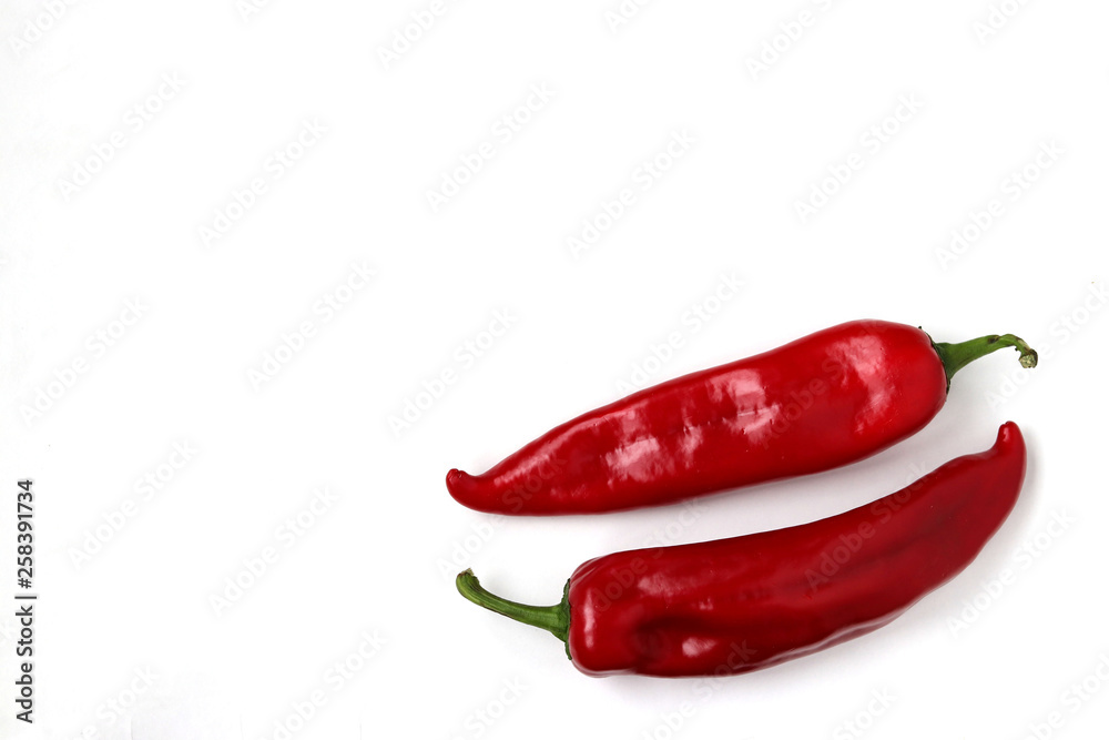 Red sweet pepper is located on a white background, copy space