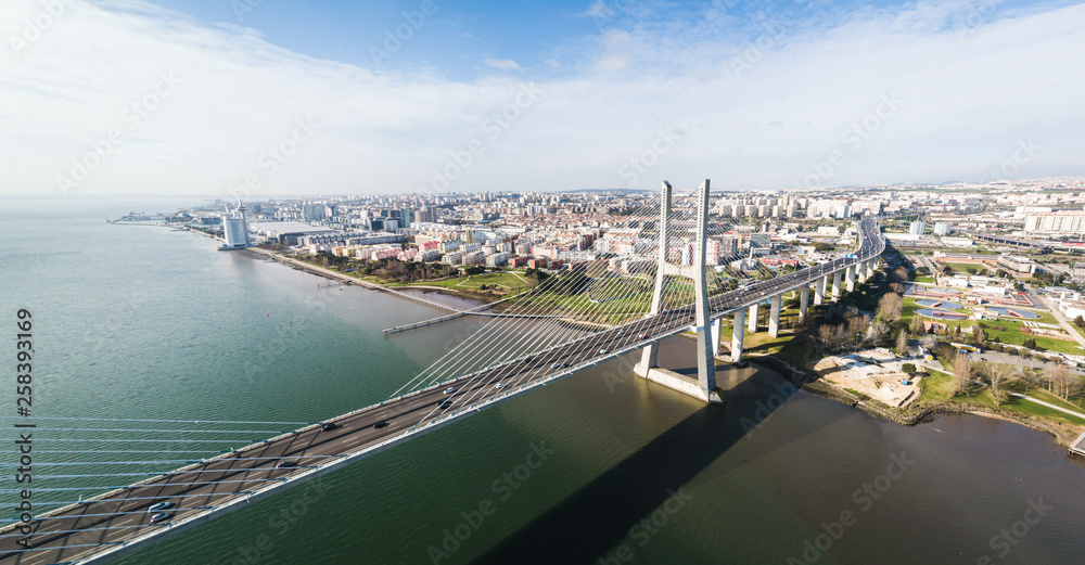 Lisbon, Portugal. March 1st, 2019. Aerial view of the Vasco da Gama Bridge and Parque das Nacoes.