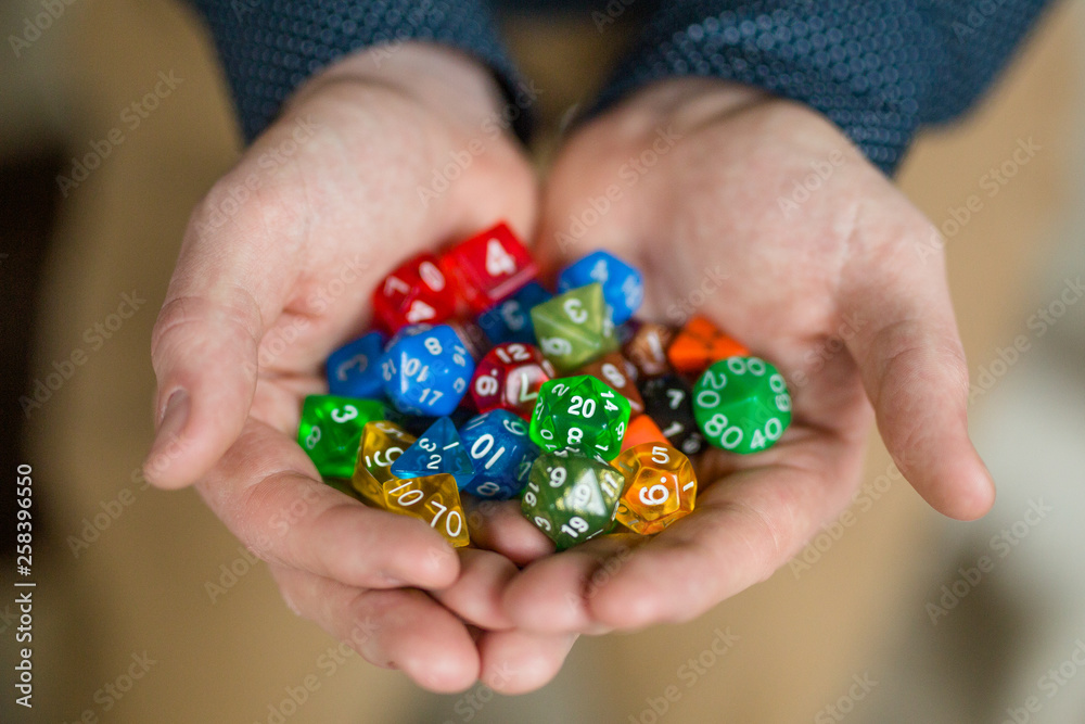 custom made wallpaper toronto digitalMan Holding a Variety of Colorful Polyhedral Dice, Dungeons and Dragons Dice
