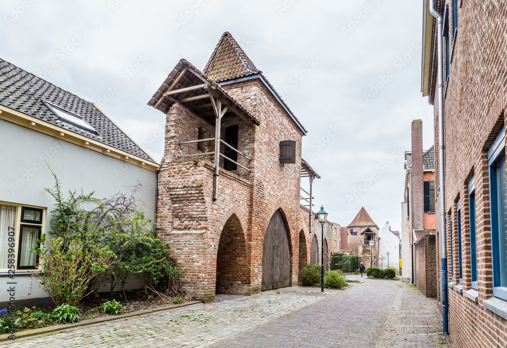 Ancient city wall  with a small house in Zutphen, a medieval city along the river IJssel in Gelderland in the Netherlands
