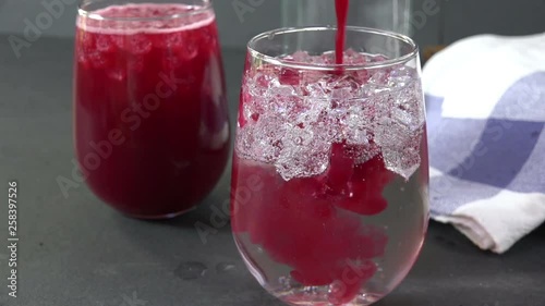 Wallpaper Mural Pouring cranberry juice into sparkling mineral water slow motion Torontodigital.ca