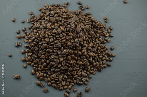 Foto Turkish or Greek Coffee in heart shaped roasted coffee beans on white rustic wooden table from top view