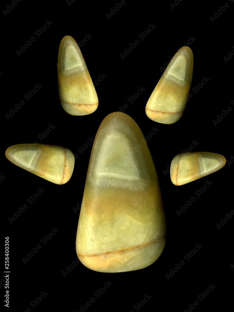 Figures laid out by children from multi-colored pebbles. Figure from multi-colored stones. Stone figures. Figures laid out by children from multi-colored pebbles. Figure from multi-colored stones. Stone figures.